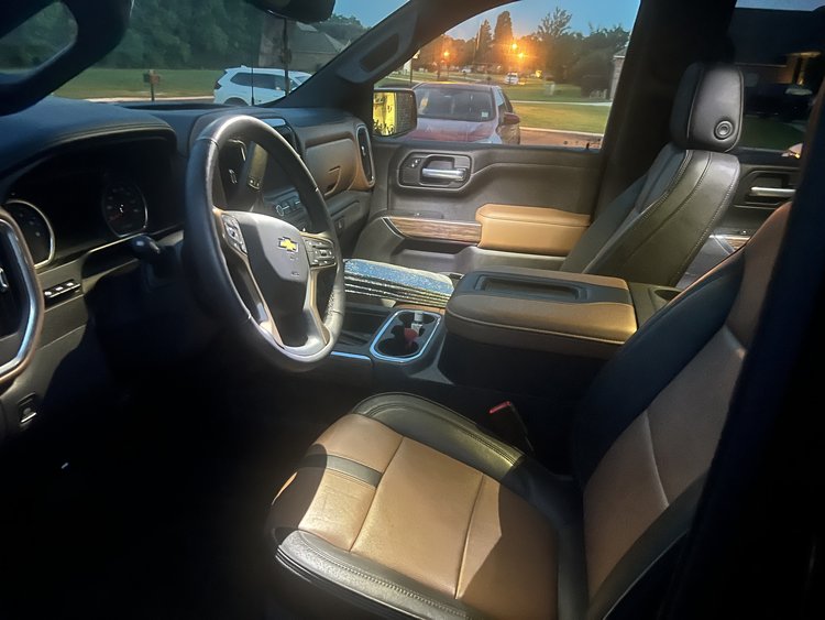 The interior of a vehicle with a view of the road